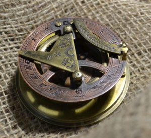 Sun-dial and compass